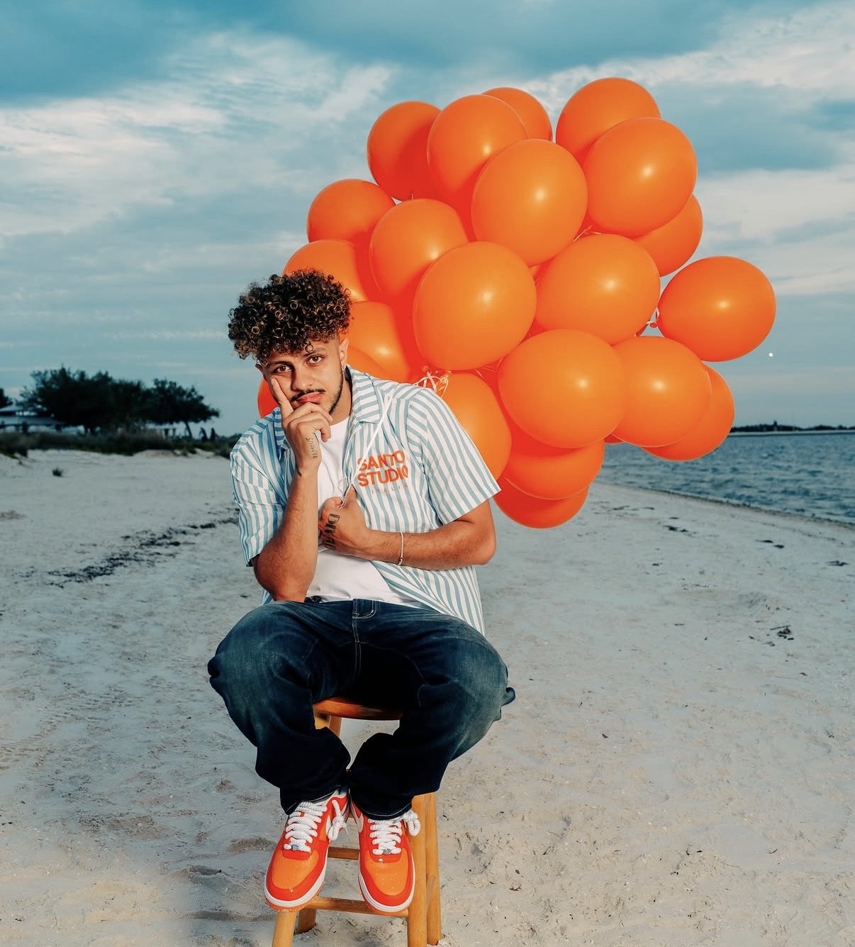 DIVAD sitting on a beach with orange balloons